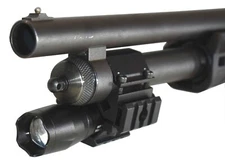 Tactical flashlight with magazine tube mount for mossberg 590a1 12 gauge model.