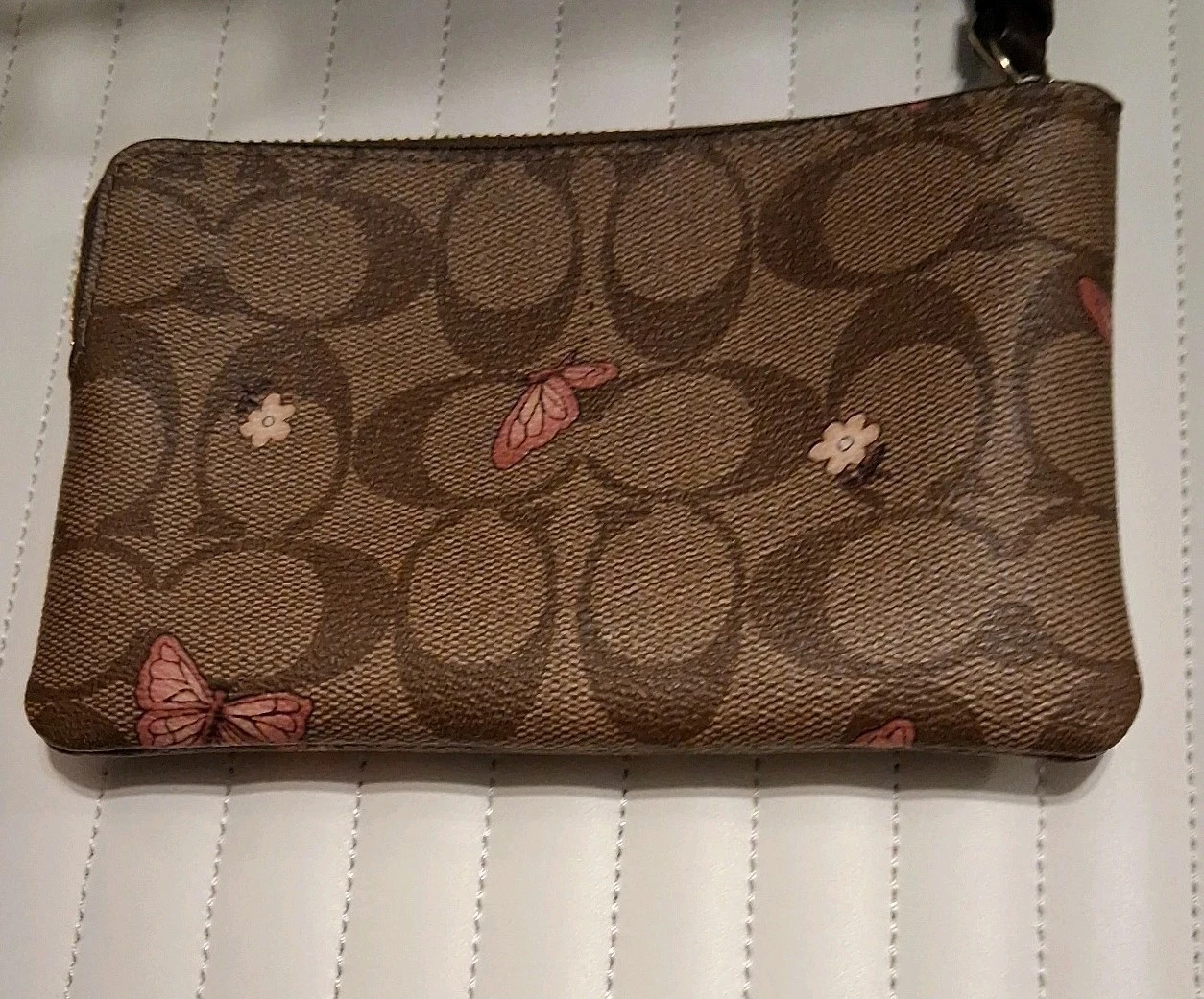 Coach Zippy Pouch da polso con stampa farfalla CC firmata