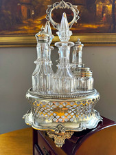 Silver metal carrier cruet set with 6 clear round glass bottles & stoppers