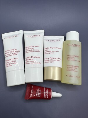 Clarins Paris TRAVEL KIT Toning/Body/Firming Lotion, Cleanser, Eye Concentrate