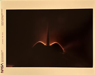 red numbered NASA photos space shuttle reentry
