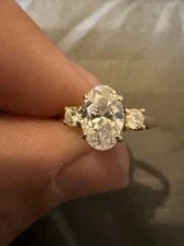 1-1/4 CT. T.W. Oval And Round Diamond Three Stone Engagement Ring 14K Gold Sz 4