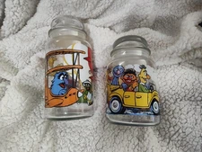 2 Muppets Inc Glass Jar w/ Lid Sesame Street Canister Cookie Monster Bert Grover