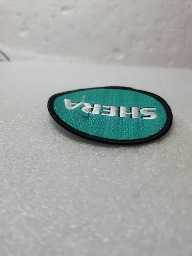 SHERA Embroidered Logo Patch Emblem Fabric Concrete Building Round Sew On Coat - Picture 7 of 8