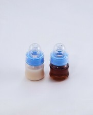 Two Sealed 2oz Reborn Baby Formula Apple Juice Bottles w/ NO HOLE NIPPLES