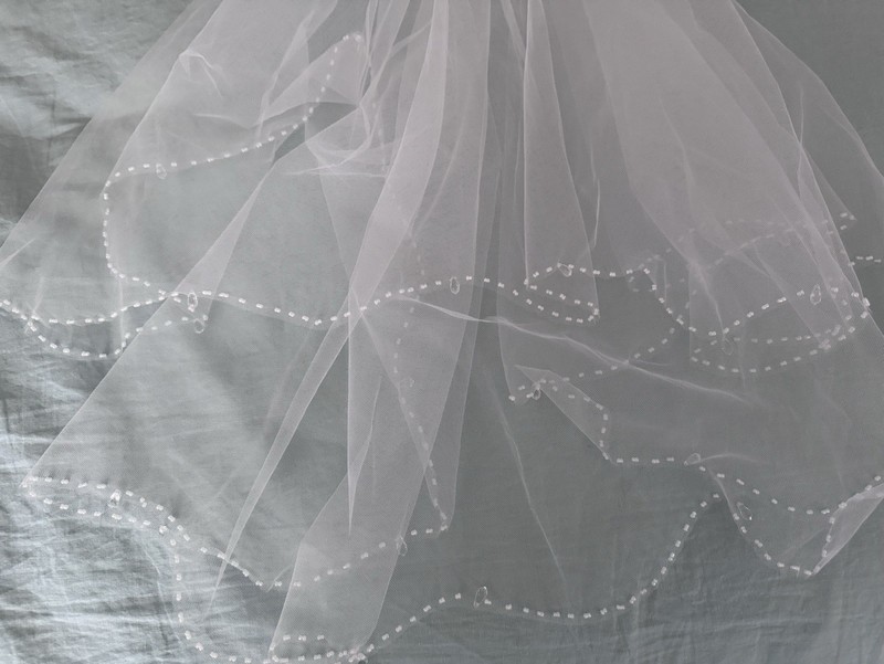 Delicate layered tulle beaded  Wedding veil. Comes with matching garter!