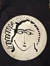 There are a total of 8 plates. All plates come with plate hangers.