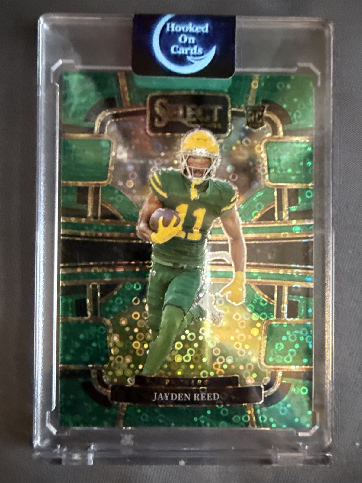 2023 Panini Select Concourse Jayden Reed #38 Green Disco Prizm /5 (RC)
