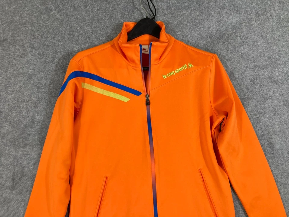 Chaqueta de chándal Le Coq Sportif para hombre pequeña naranja cremallera completa mangas largas bolsillos Foto 2 de 4