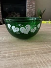 Emerald green glass bowl with white grape leaf pattern by Anchor Hocking