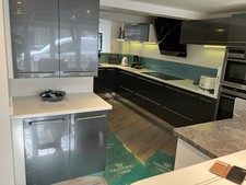 GREY GLOSS KITCHEN WITH WHITE AND GREY WORKTOPS MADE BY INTOTO