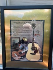 A FRAMED MAGAZINE PRINT OF AN ADVERTISEMENT OF A D-41 MARTIN GUITAR