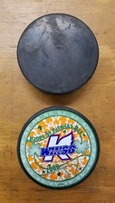 Kalamazoo Wings Hockey Pucks - Happy St. Pat's Day and Black Puck - Used 2009