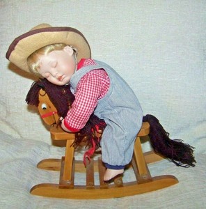 doll on rocking horse