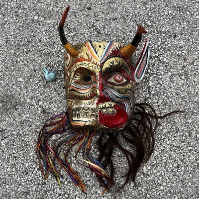 Split personality day of the dead Diablo mask.