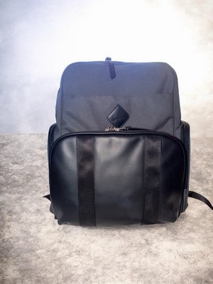 This backpack is the Ergobaby Anywhere I Go Diaper Backpack in gray and black, 