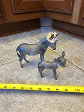 Hagen Renaker Donkey Adelaide wearing hat with flowers (1956) and Harry (1955)