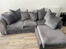 Large and spacious grey L-shaped corner sofa with chaise