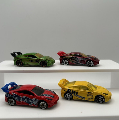 Hot Wheels Lot of4 Toyota Celica: Green Flames, Yellow RHL, Red Stars, Dragon.12