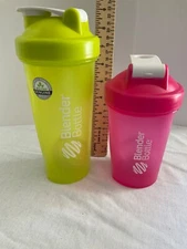 Two Blender Bottle drinking tumblers with lids