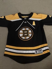 Boston Bruins YouthL/XL NHL official licensed replica jersey black/gold BERGERON