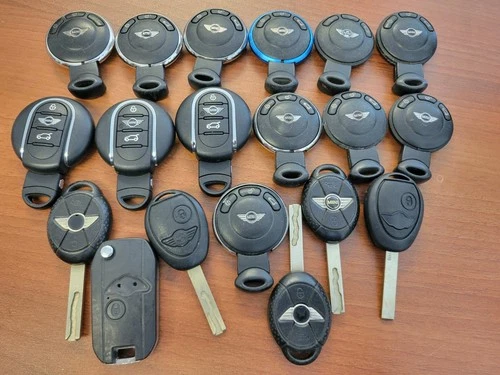 Lot of 19 OEM Assorted genuine MINI Cooper key fobs and remote keys Keyless BMW - product listing photo