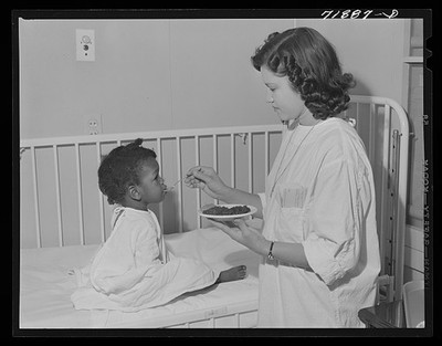 Eleven Mile Corner Arizona 1942 NYA Girl Feeds Child at Cairns General Hospital