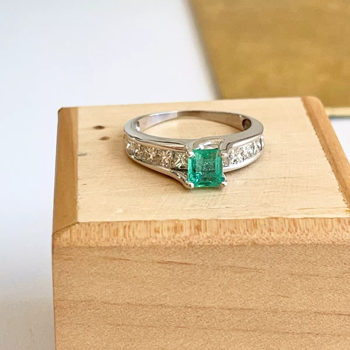 Channel set store emerald ring