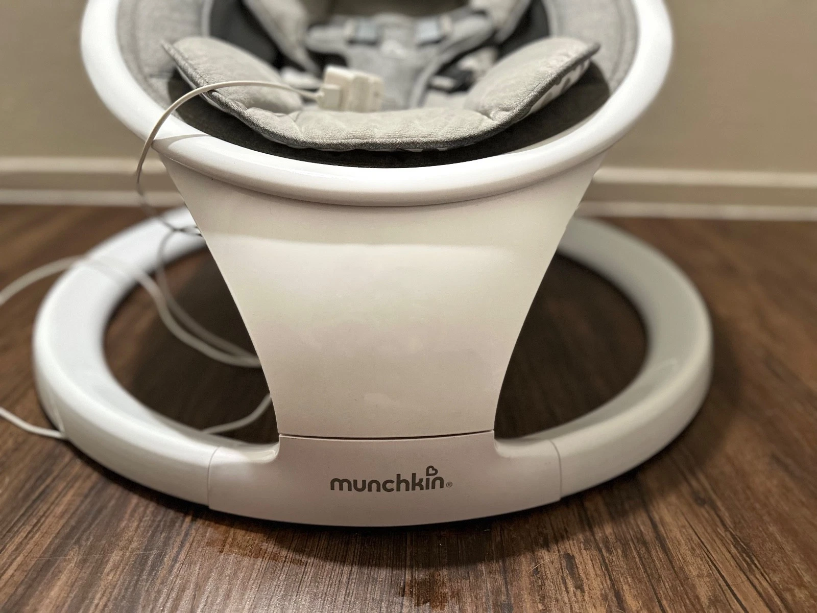 Munchkin baby swing, Gray and white. All padding is washable. Remote is included