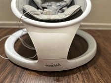 Munchkin baby swing, Gray and white. All padding is washable. Remote is included