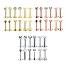 Lot de 12 bijoux en acier pour oreilles et lèvres.