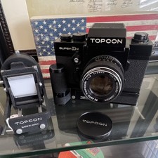 Topcon Super DM Black SLR Film Camera with RE Topcor Lens Topcon Auto Winder