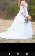 Davids Bridal wedding dress size 14 used once. Includes bustier and slip