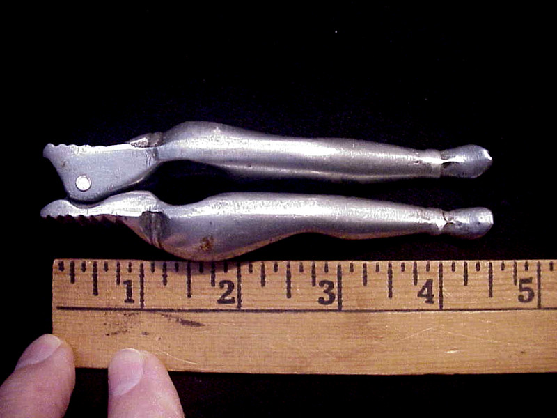 VINTAGE ALUMINUM NOVLTY NUTCRAKER  WOMANS LEGS OLD