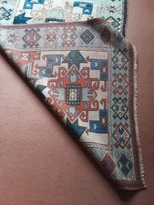 A Turkish Woollen Rug of Caucasian/Kelim Design. 202cms x 137cms.