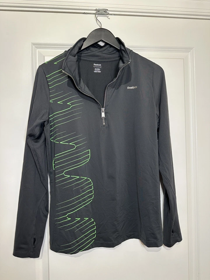 Pullover deportivo Reebok para mujer con cremallera en cuarto negro talla grande Foto 2 de 4