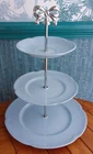 3 tier cake stand made from baby blue plates with silver ribbon bow handle