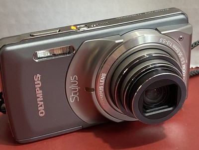 Olympus Stylus 7010 12.0MP Digital Camera Silver Point Shoot Works w/Batt And SD