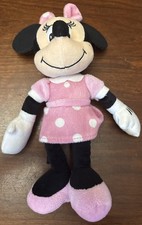 Minnie Mouse Disney Jr Plush in a pink dress with white polka dots.