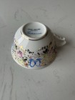 Porcelain teacup by Vista Alegre, handpainted with floral design and gold trim — photo 3