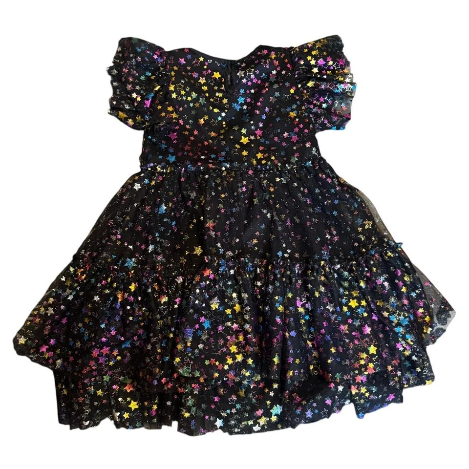 Vestido de fiesta LOLA + THE BOYS para niñas con lentejuelas fondo negro estrellas multicolores (8) Foto 2 de 4