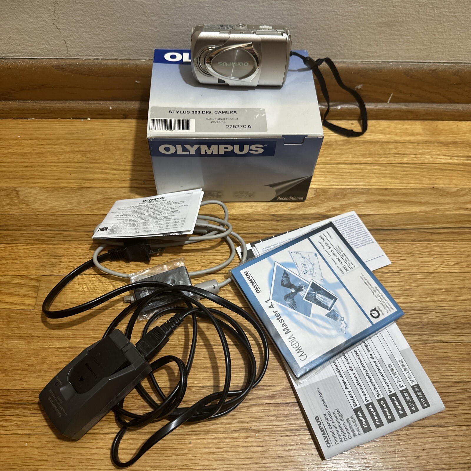 Olympus Stylus 300 Digital 3.2MP Digital Camera Bundle, Remote Charger