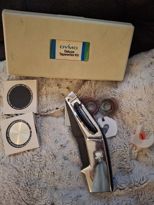 Vintage DYMO 1570 Chrome Black Label Maker W/ Case Extra Roll 3 wheels excellent
