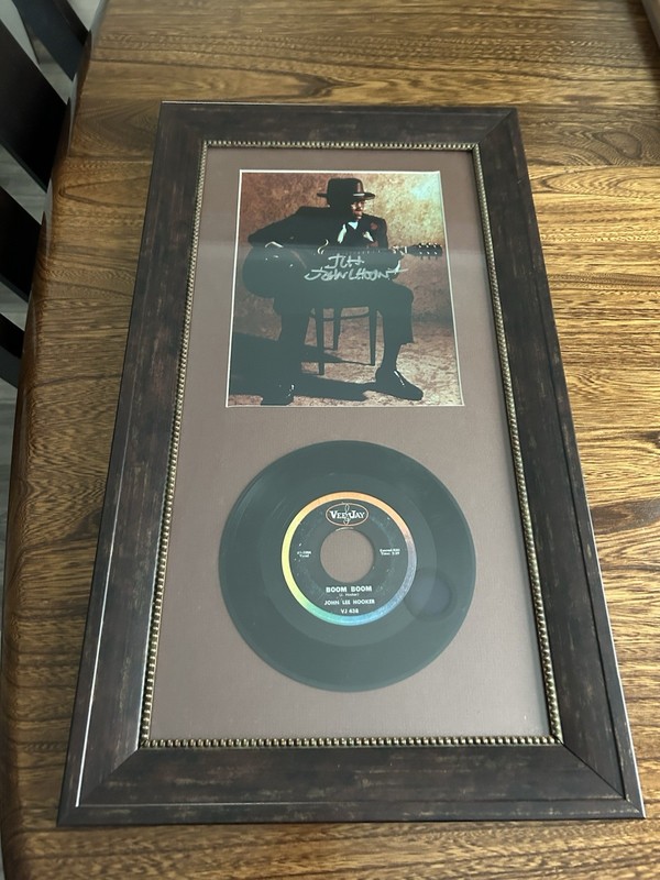 JOHN LEE HOOKER AUTOGRAPHED PICTURE FRAMED AND MATTED WITH A RECORD
