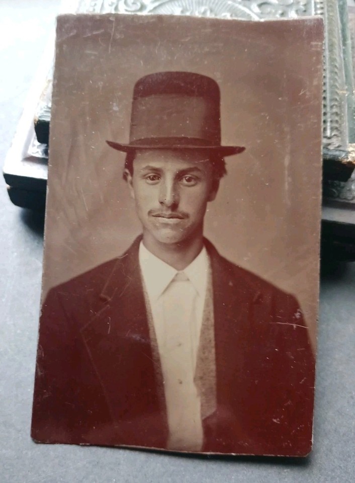 An 1870s tintype photo of a dapper gentleman in a top hat — a genuine 150-year-old artifact that's endlessly cool framed on a desk or study wall.