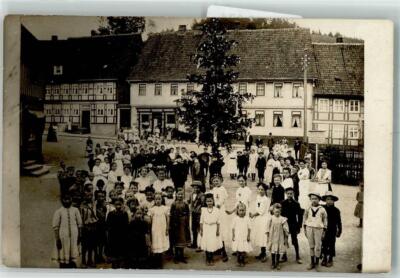39736874 - Christmas tree decorated in the village square all villagers children