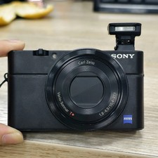 Sony RX100 20.2 MP 3.6x Zoom Compact Digital Camera with Charger Battery English