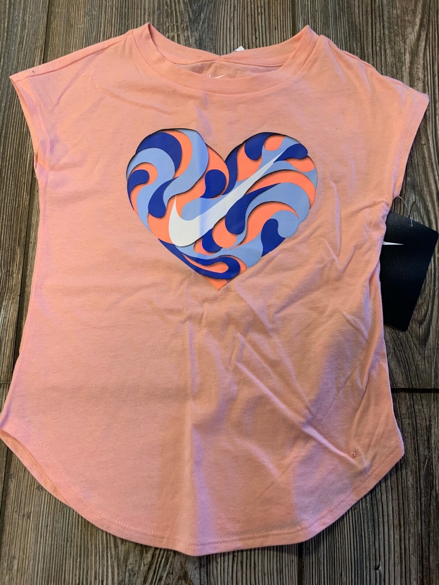 coral color nike shirt