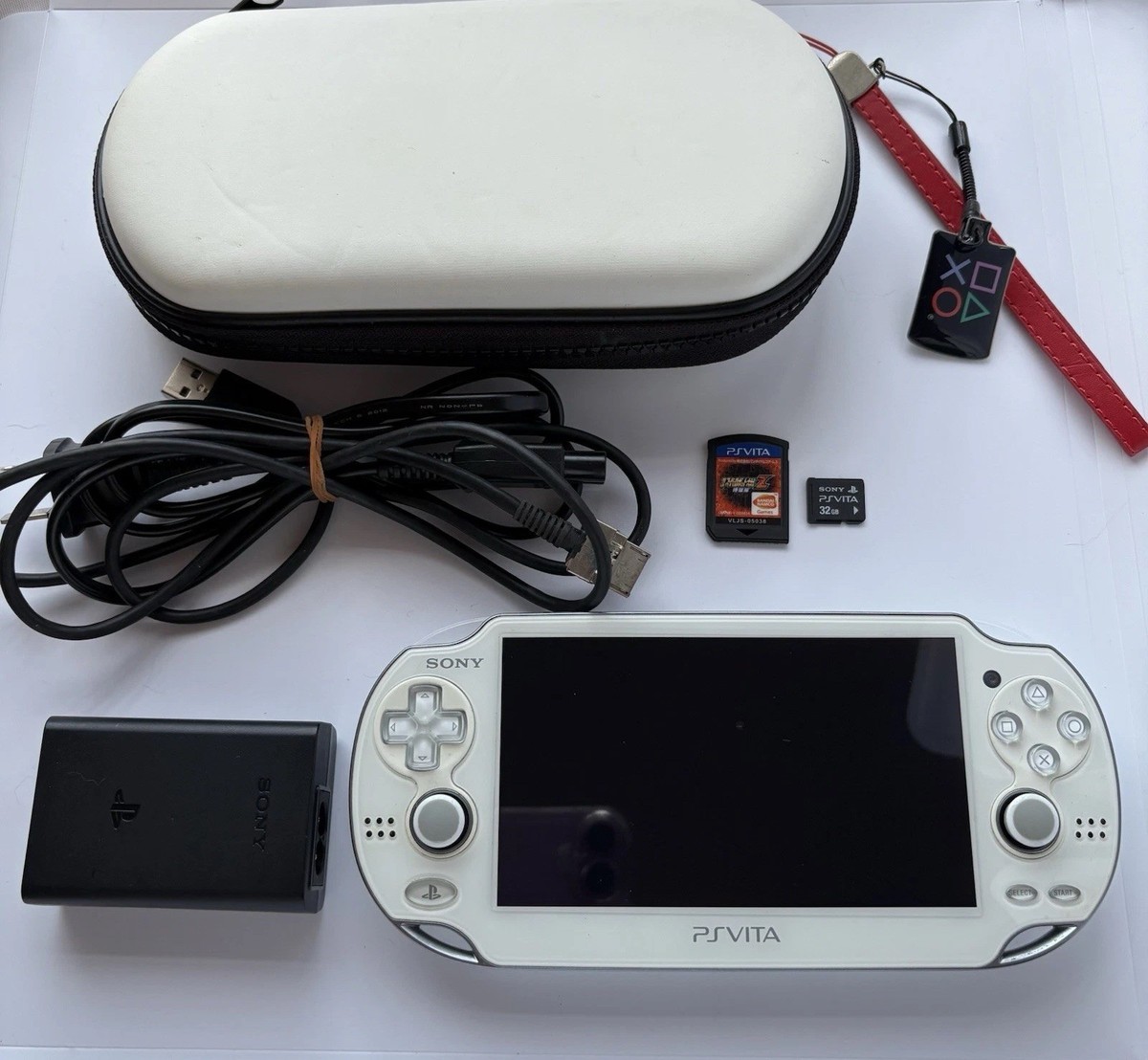 Excellent SONY PS Vita PCH-1100 Crystal white w/one game and 32GB