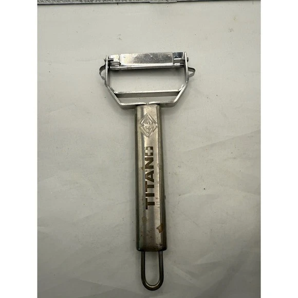 Utensilio de cocina pelador de cuchillas giratorias de acero inoxidable Titan 2 Foto 3 de 4